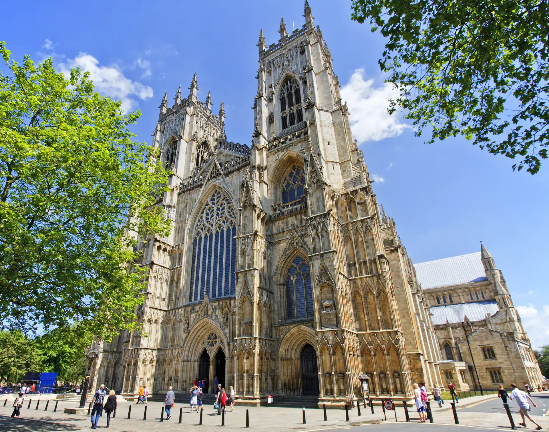 York Minster Cathedral towering against a clear blue sky.